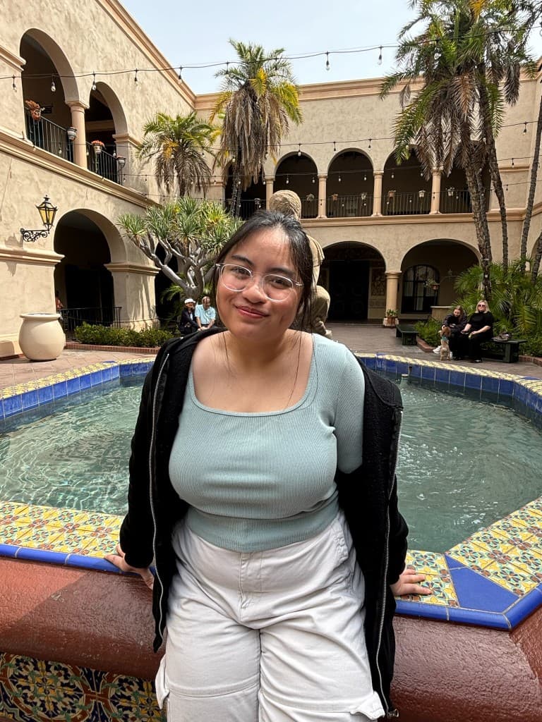 Adriana So at a courtyard fountain